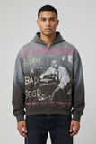 Front view of male model wearing washed charcoal Concept Bad Seed zip-up hoodie